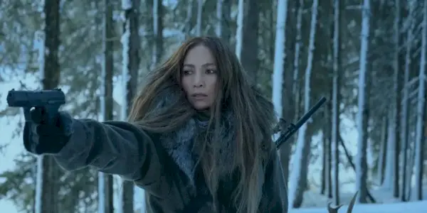 Jennifer Lopez pointing a gun in The Mother