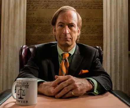 Saul (Bob Odenkirk) sitting at his desk with his 