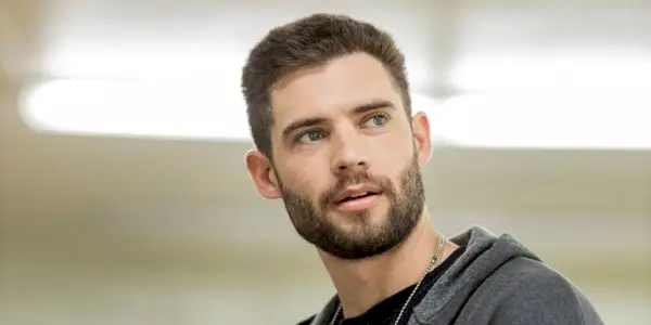 David Corenswet as David McDougall looking back at a person offscreen in We Own This City 