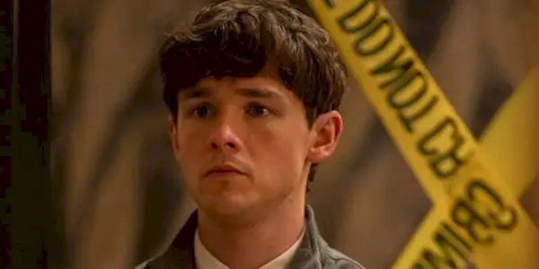 Harrison (Jack Alcott) looking worried in front of DO NOT CROSS tape in 