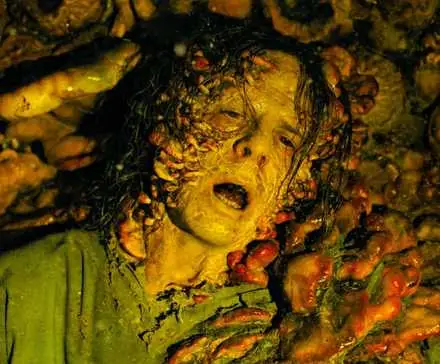 An infected person attached to a wall and surrounded by cordyceps fungi in The Last of Us Season 2