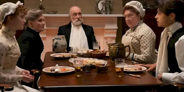 The servants in the van Rhijn house sitting around a table in The Gilded Age