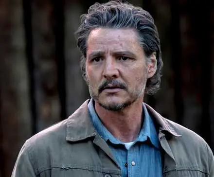 Pedro Pascal as Joel out in the woods looking concerned in The Last of Us Season 2