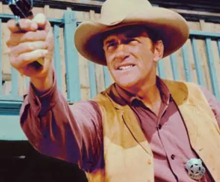 Marshal Dillon (James Arness) fires on 