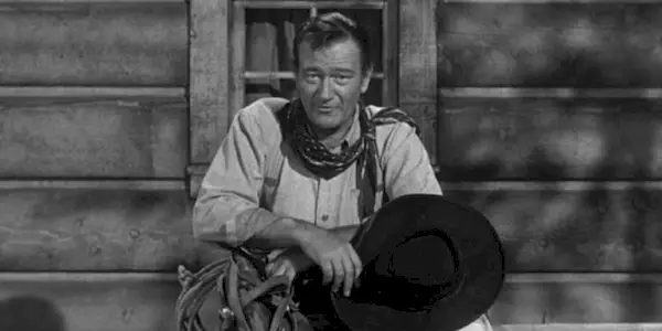 In che modo Gunsmoke ha portato all'introduzione di John Wayne?
