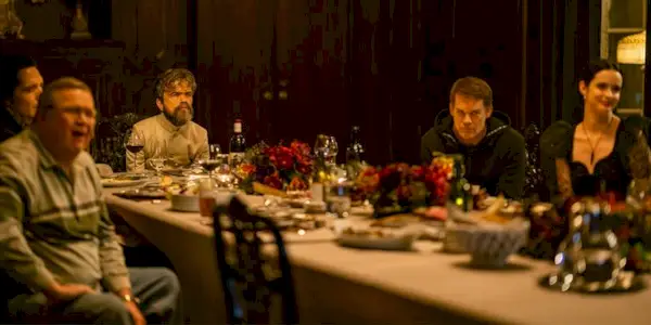 Dexter (Michael C. Hall) sits at a dinner party on 