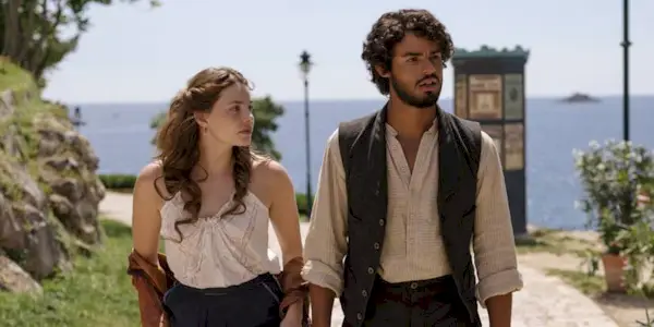 Nan (Kristine Froseth) and Guy (Matthew Broome) walking together in The Buccaneers Season 2 Episode 4