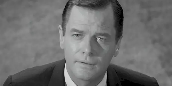 Martin Sloan (Gig Young) staring wistfully at his hometown in 