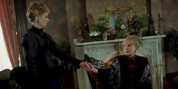 Cynthia Nixon and Christine Baranski holding hands in The Gilded Age Season 3