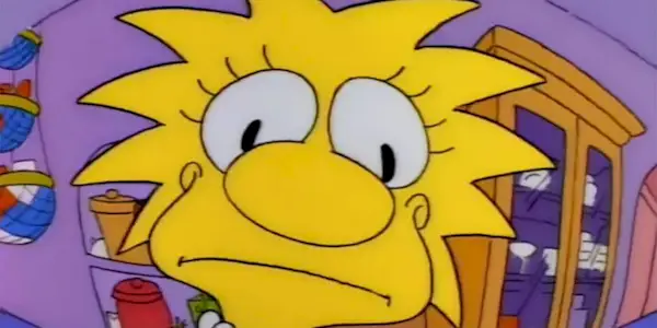 Lisa looking into the reflection of a spoon at herself in The Simpsons episode 