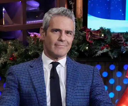 Andy Cohen smiles while hosting Watch What Happens Live on Bravo.