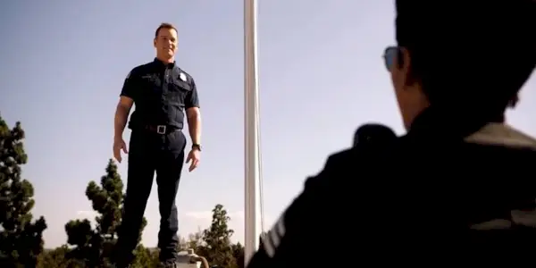 Bobby Nash high and smiling on the roof of the 118 fire station while Athena tries to talk him down in 9-1-1 