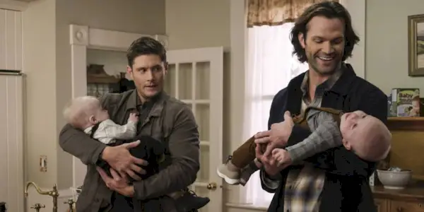 Supernatural sam and dean holding babies