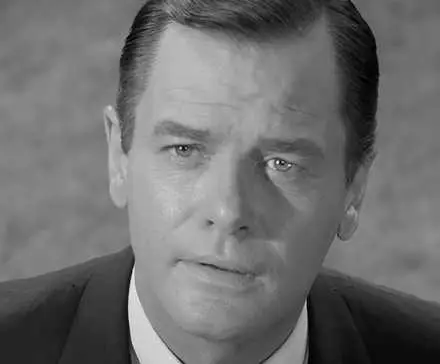 Martin Sloan (Gig Young) staring wistfully at his hometown in 