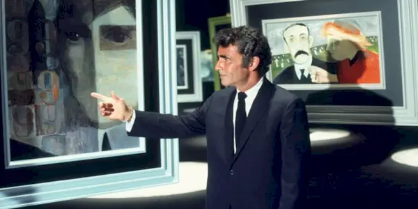 Rod Serling pointing a painting in 