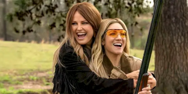 Margo (Malin Åkerman) hugs Sophie (Brittany Snow) in the Netflix mystery series The Hunting Wives.