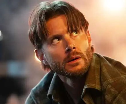 Mark Meachum (Jensen Ackles) looks up at his chief, off-screen, after one of their own has died in a scene from Countdown Season 1.