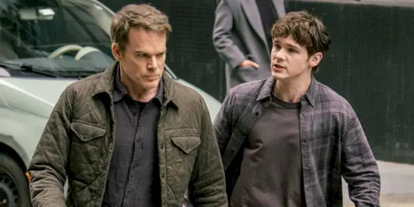 dexter-and-harrison-morgan-walking-in-the-street-in-dexter-resurrection-season-1.webp