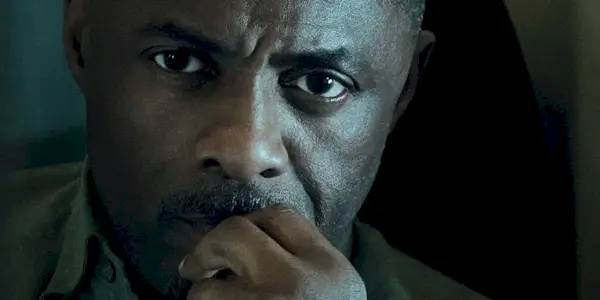 Idris Elba as Sam Nelson staring ahead intently on a cropped poster for Hijack