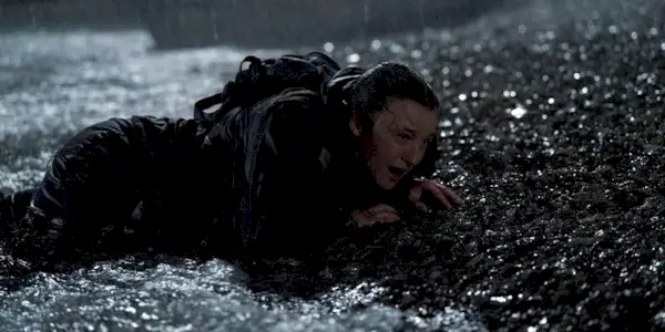 Bella Ramsey as ellie crying in the rain in The Last of Us Season 2 Episode 7