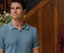 Nathan (Robbie Amell) and A.I. Guy (Owen Daniels) standing in the Lakeview lobby in Upload Season 3