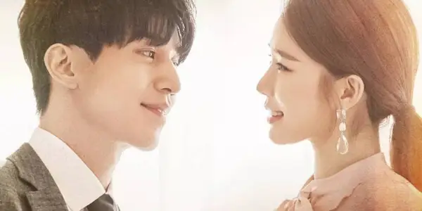 A close-up shot of Yoo In Na and Lee Dong Wook smiling at each other in Touch Your Heart