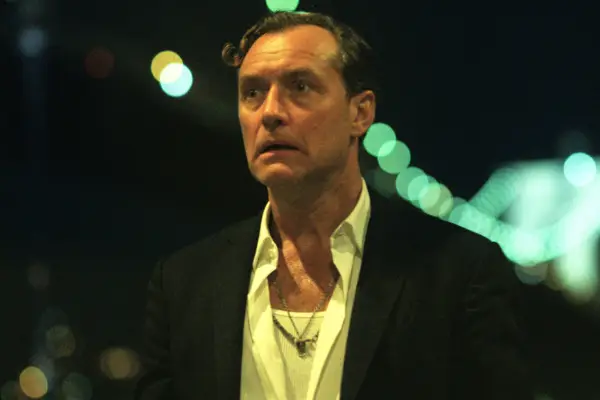 Jude Law as Jake Friedken in Black Rabbit, looking shocked.