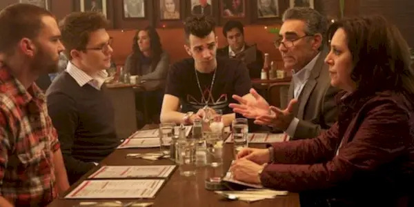 Characters from Goon at a bar talking.