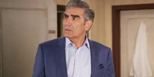 Eugene Levy as Johnny Rose looking confused in the Rosebud Motel in Schitt